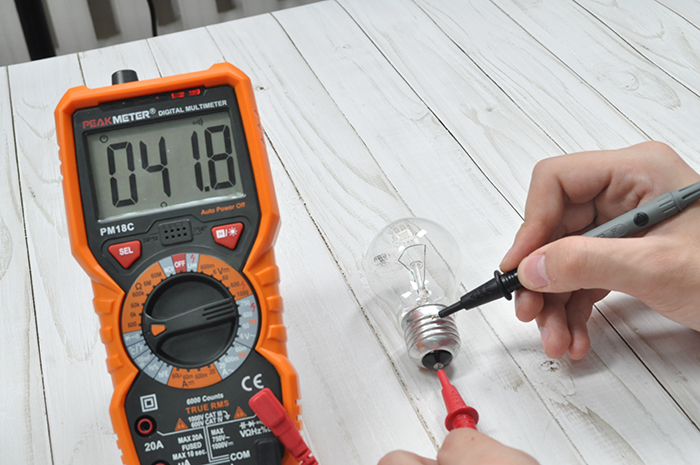 Using a multimeter to test a light source