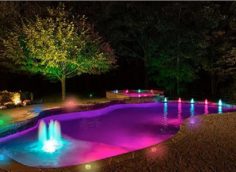 Different coloured lighting with fountains.