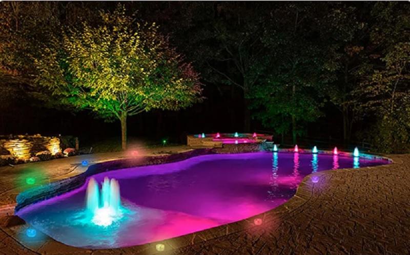 Multicolored illumination along with fountains.