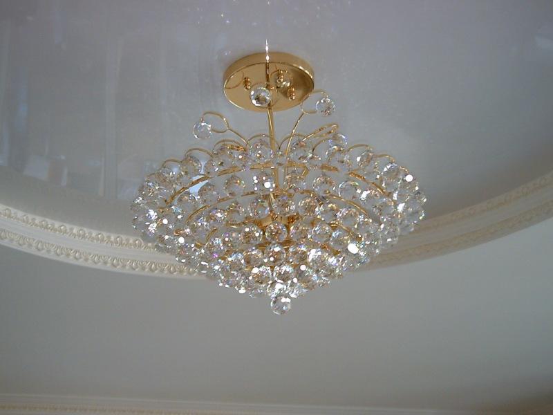 Chandelier installation on the suspended ceiling